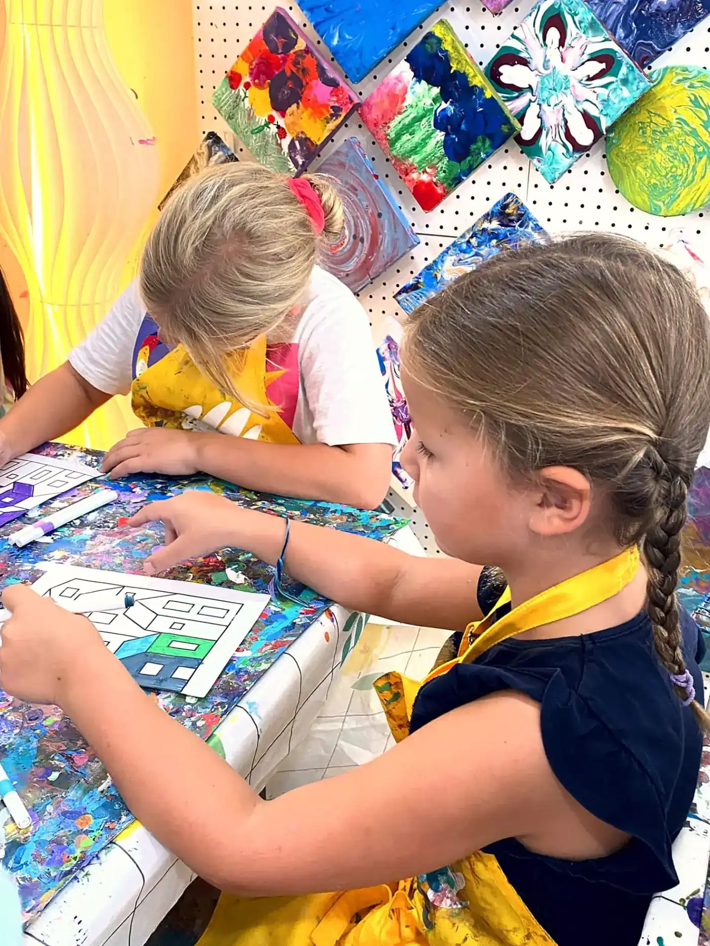 Siblings drawing side by side at Blank Space art camp