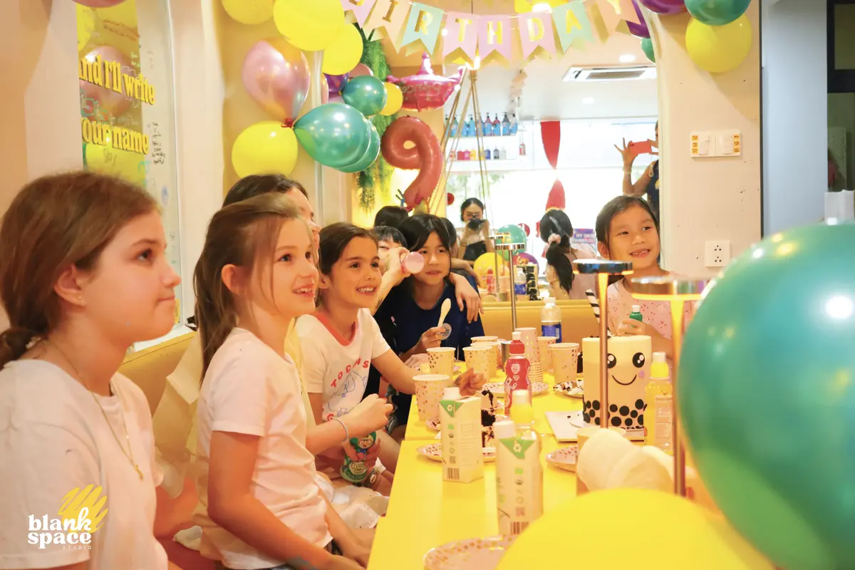 Kids celebrating a birthday party with paint pouring in Ho Chi Minh City