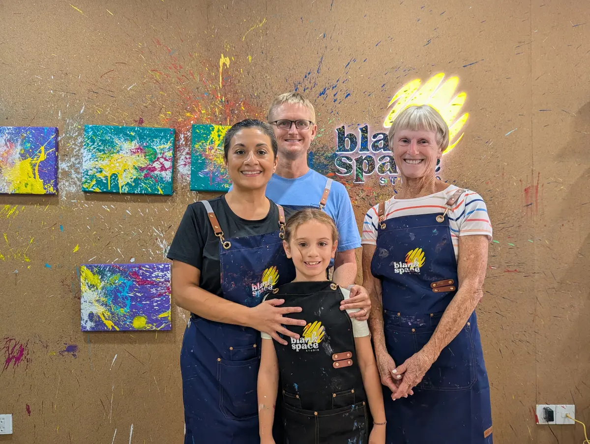 Family bonding with balloon paint splatter at Blank Space Studio Saigon
