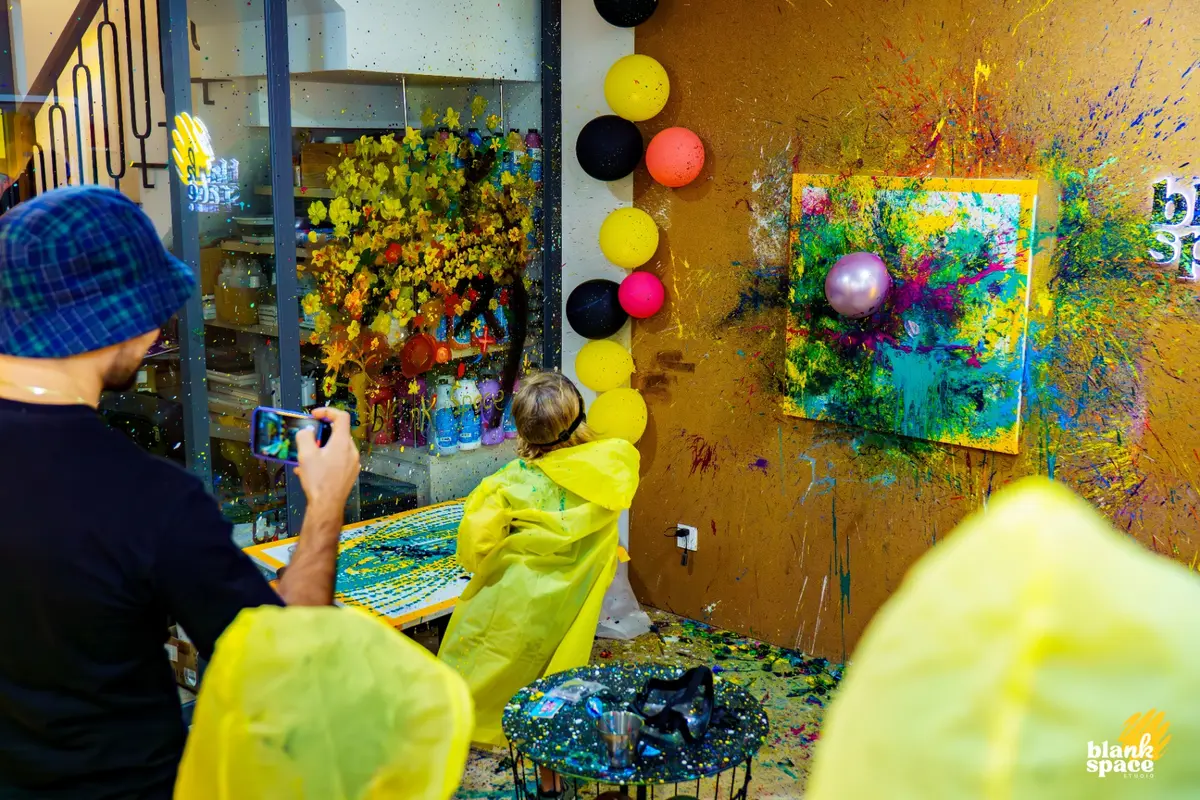 Family enjoying a splatter paint session together in Ho Chi Minh City
