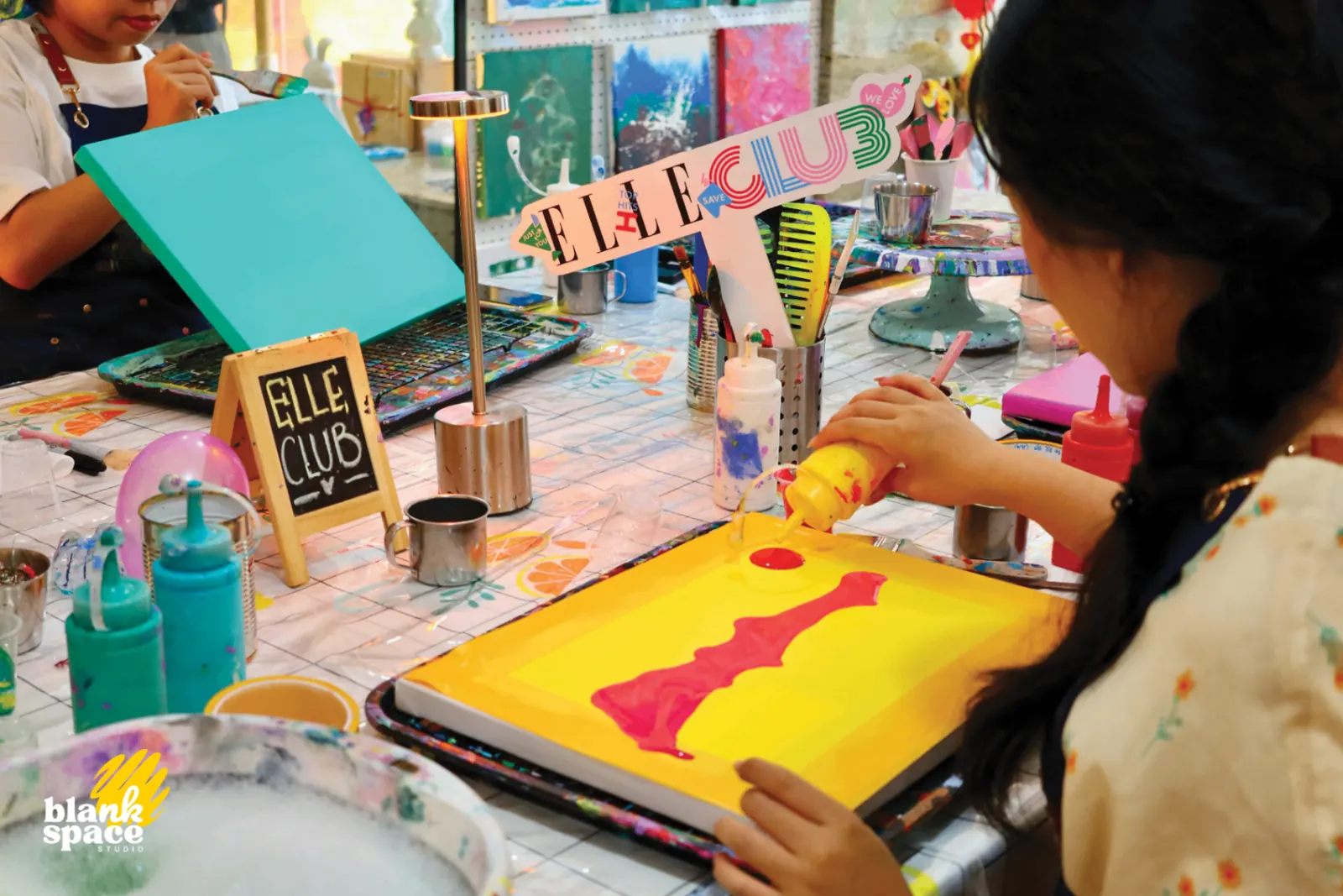 Close-up of a colorful team bonding canvas in progress at Blank Space Studio