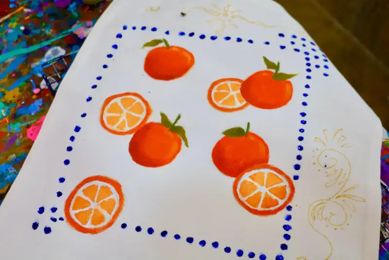 Hand painted tote bag with oranges from a tote design activity
