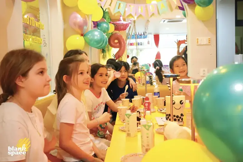 Kids celebrating a birthday party with paint pouring in Ho Chi Minh City