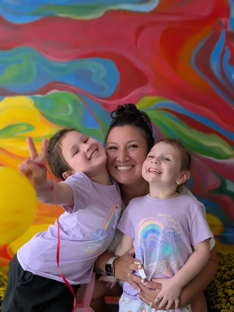 Family with kids at a colorful art workshop in Saigon