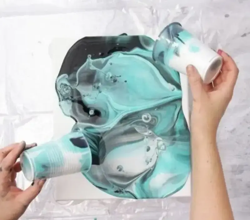 Vibrant swirling paint pour artwork from a creative session near Thao Dien
