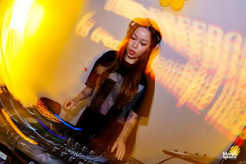 DJ performing at a sip and paint evening event in Saigon