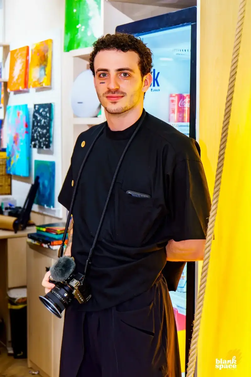 Photographer capturing a creative evening event in Ho Chi Minh City