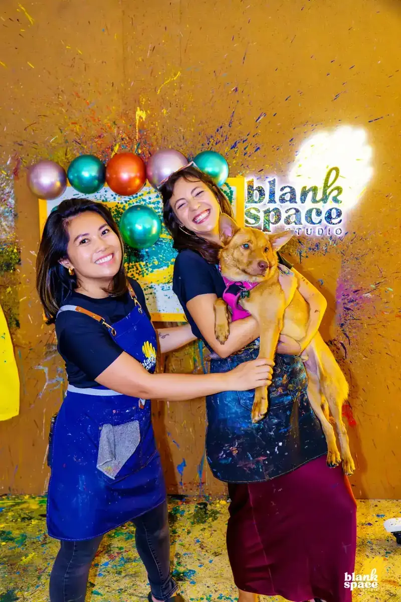 Staff with Deogi the studio dog at Blank Space Studio Saigon