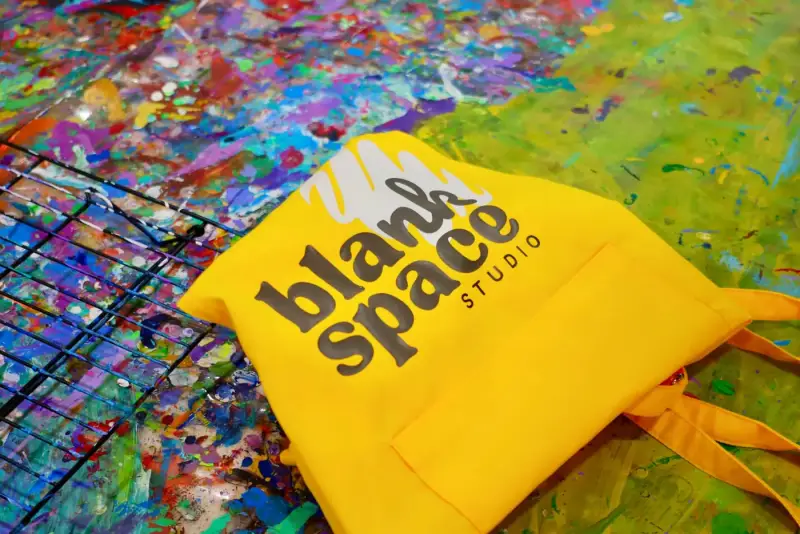 Blank Space Studio branded aprons provided for every guest at a private studio event in Saigon