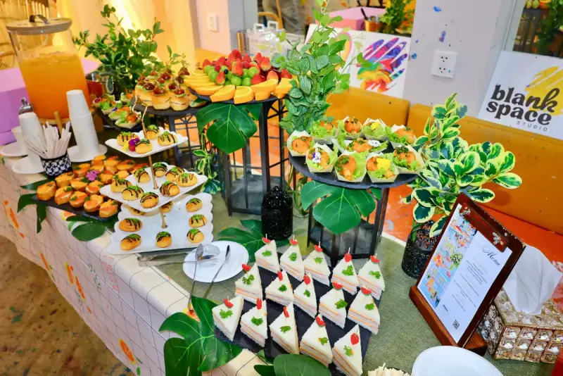 Catering table with finger food ordered through our partner for a private studio event in Saigon