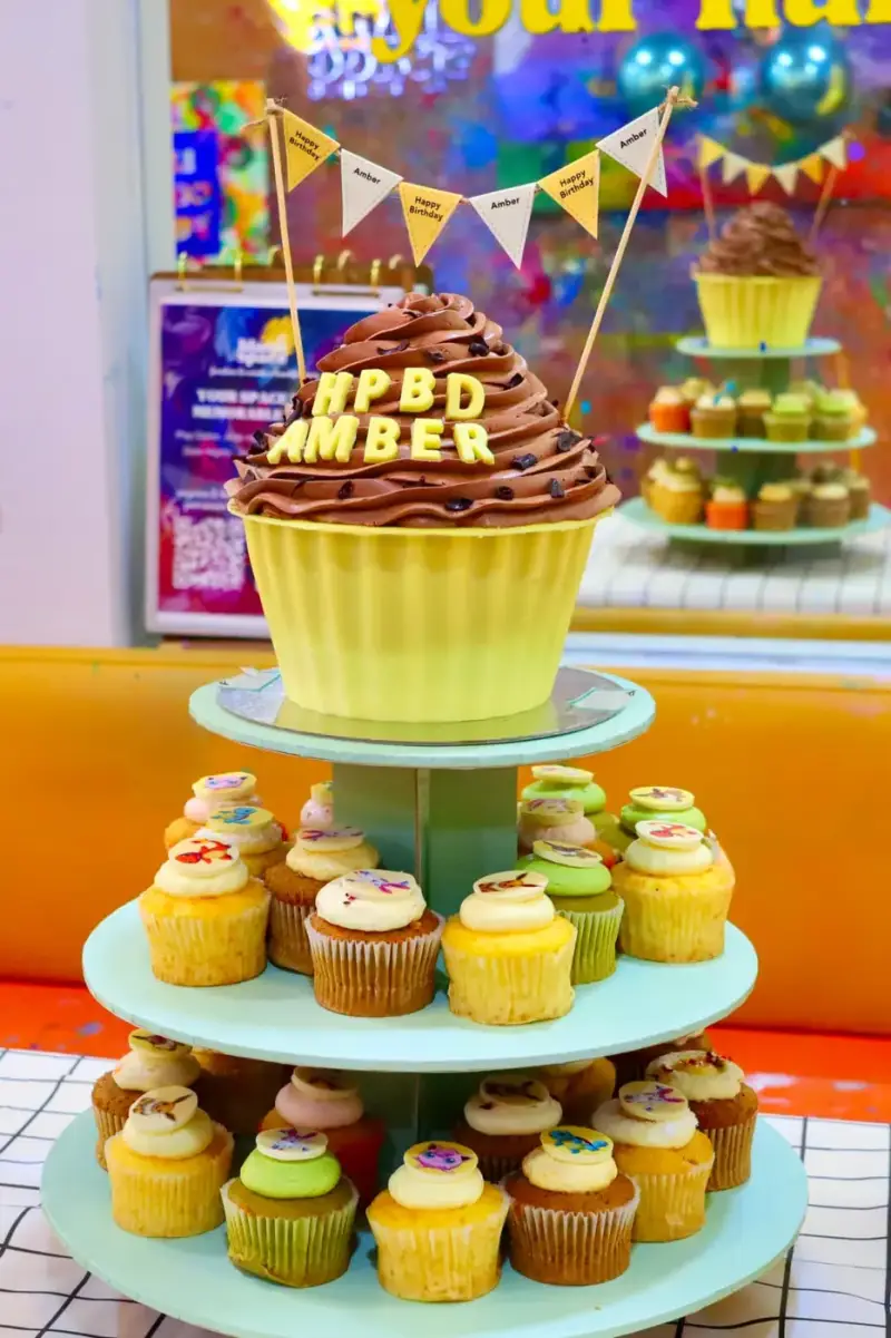 Custom cupcake tower set up for a private birthday event at Blank Space Studio