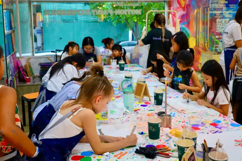 Guests engaged in creative activities during a private studio event near Thao Dien