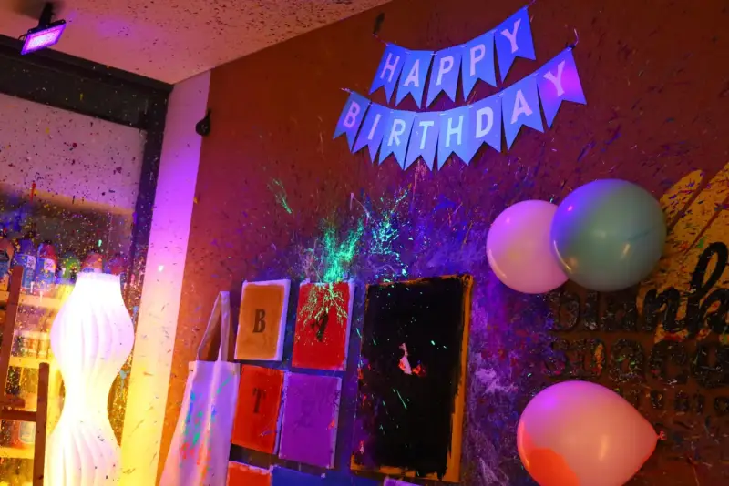 Glow in the dark birthday setup in the private studio at Blank Space Studio Saigon
