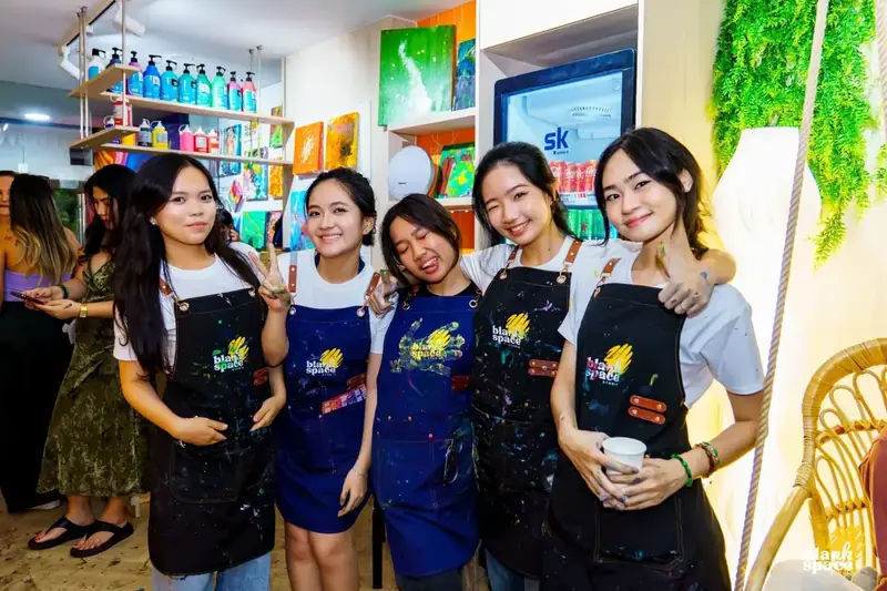 Blank Space team in aprons at a team building activity in HCMC
