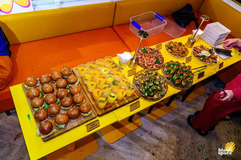 Catering setup at a corporate paint pouring event in Saigon