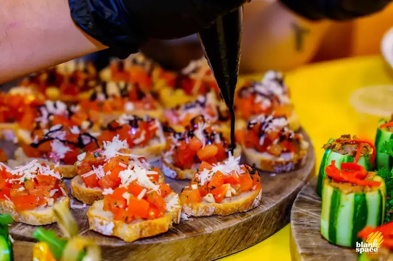 Catering spread at a corporate paint pouring party in Saigon